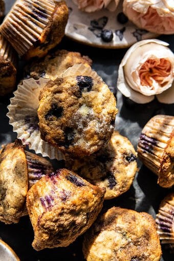 overhead photo of muffins with butter melting over warm muffin