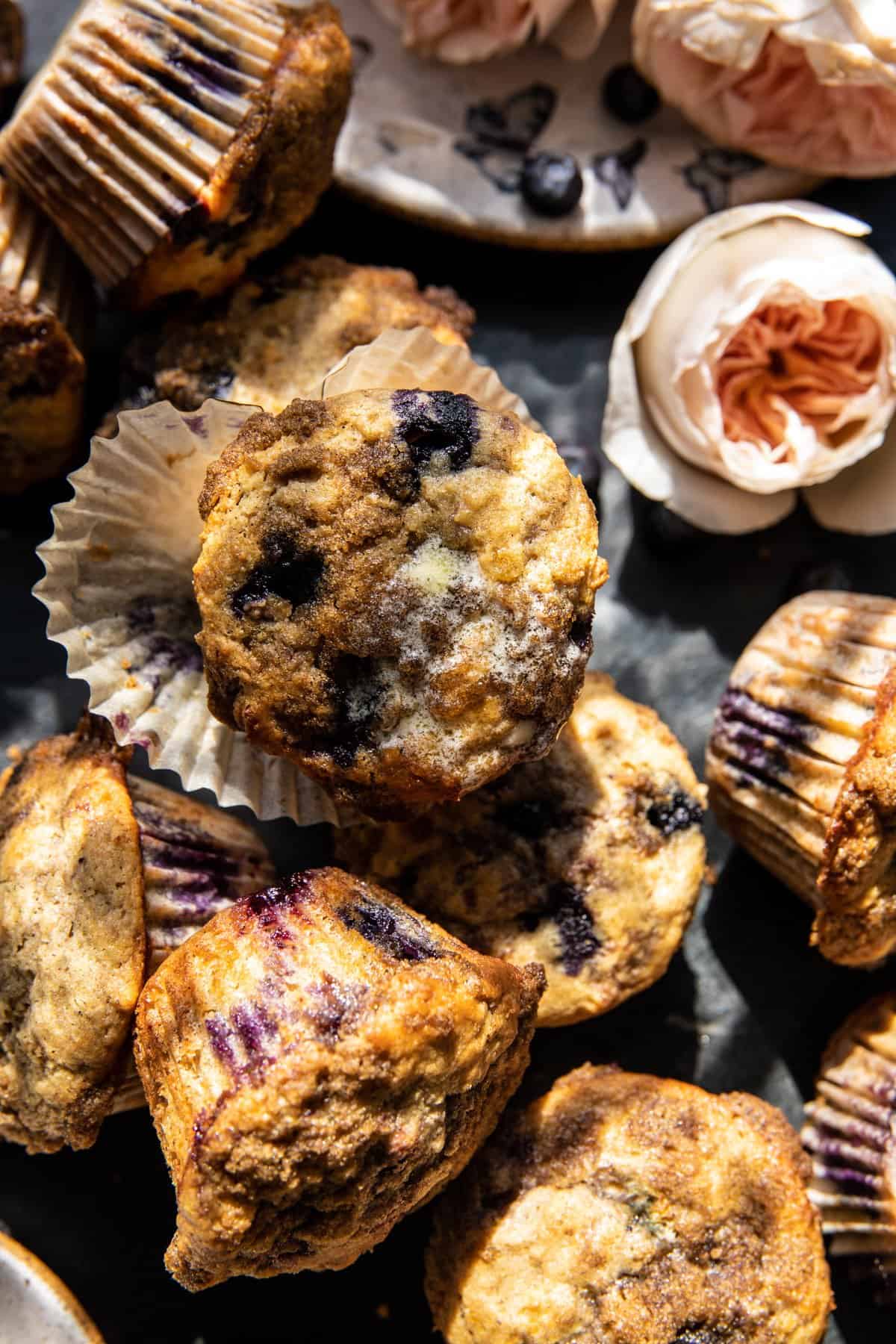 overhead photo of muffins with butter melting over warm muffin